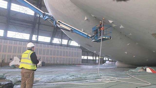 Airliner being filled with helium prior to floatation 