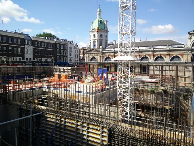 The construction site where the east ticket hall will be located, with Smithfield Market in the background. 