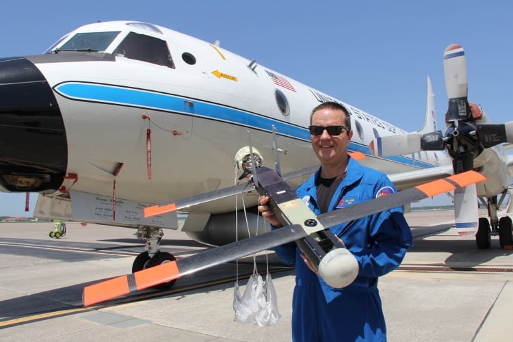 Dr Joe Cione with the Coyote in front of the NOAA's P-3 aircraft (Source: NOAA)