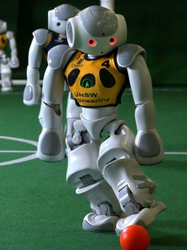 UNSW robot kicks a ball in the RoboCup World Championships