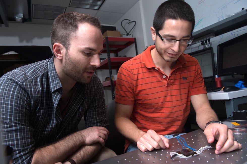 Jacob Robinson, left, assistant professor of electrical and computer engineering, & graduate student Daniel Gonzales (Jeff Fitlow/Rice University)