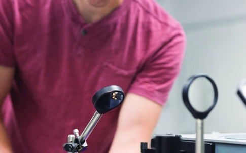 Graduate student Bryan VanSaders measures how much simulated sunlight a novel material can absorb using a unique set of instruments that takes spectral measurements from visible to infrared. This testing is led by electrical engineering professor Zhaowei