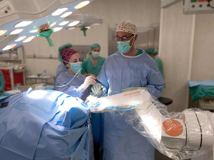 Surgeons working with the Neuromate robot 