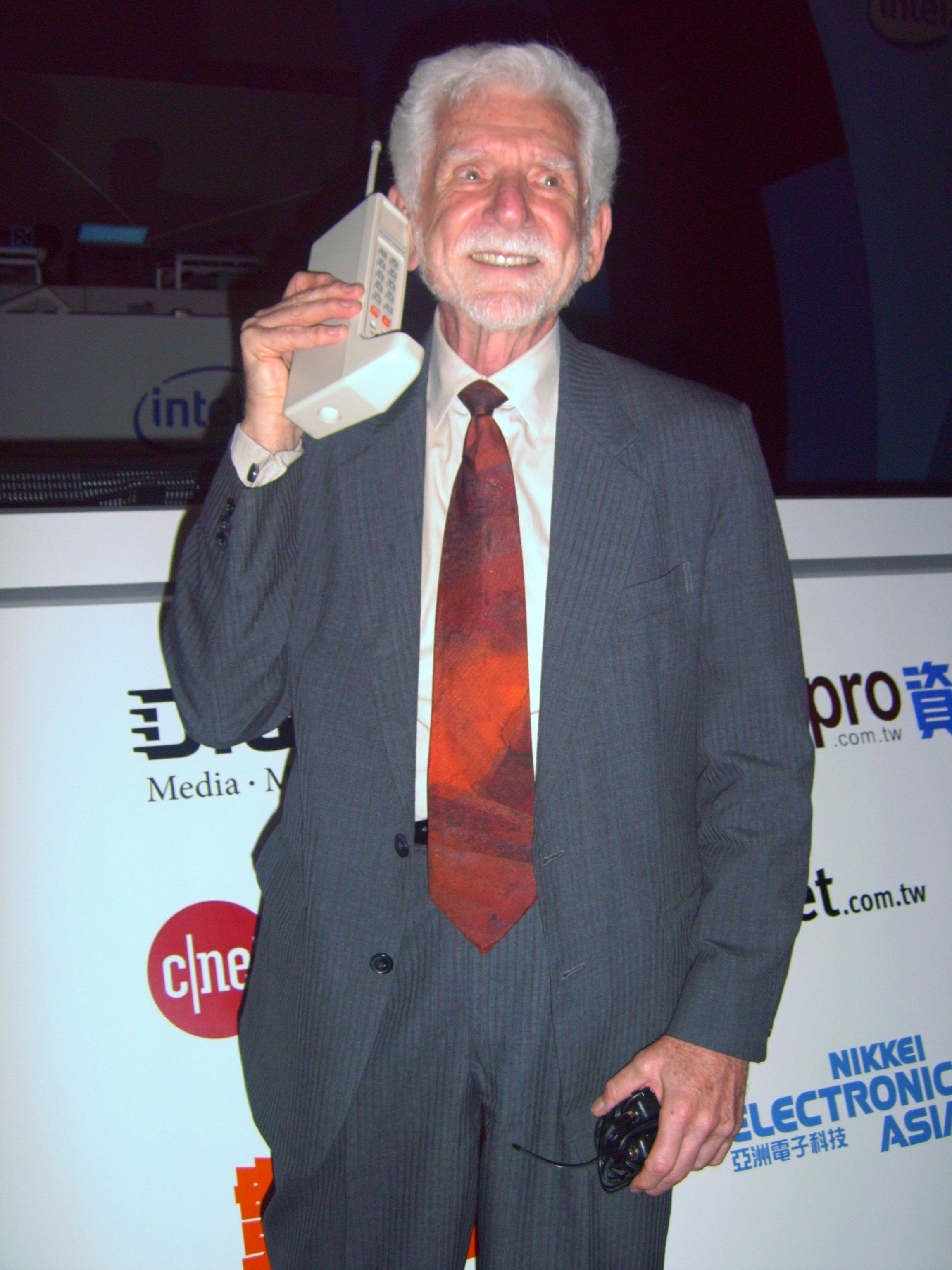 Motorola's Martin Cooper reenacting the world's first hand-held mobile phone call with the Motorola DynaTAC
