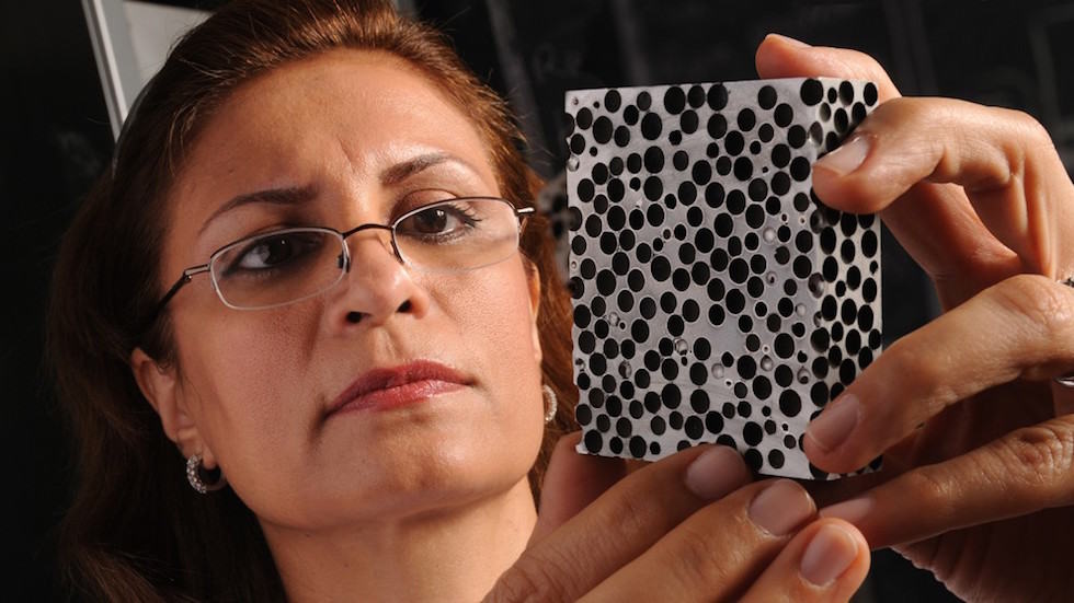 Afsaneh Rabiei examines a sample of composite metal foam