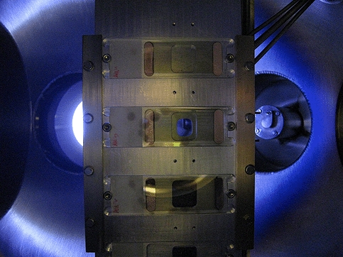 This image depicts the inside of the deposition chamber taken when scientists are depositing the insulating film. Credit: Prof. Chris Binns, Leicester University.