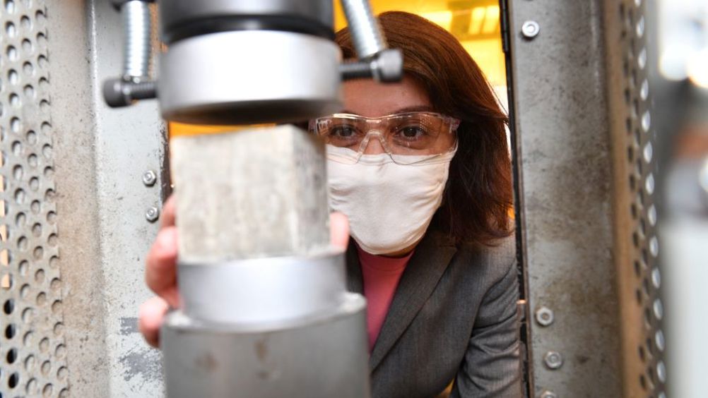 Assoc. Prof. Somayeh Nassiri strength-tests a block of chitin-boosted cement