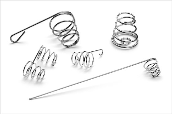 Conical formed compression battery springs 