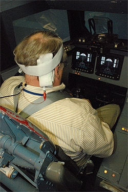 A three-time space shuttle commander uses the Galvanic vestibular stimulation (GVS) system during a space shuttle landing simulation. The GVS delivers small amounts of electricity to the vestibular nerve, which then sends the signals to the brain, resulti