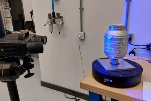 The WAAM built tank being 3D scanned for distortions and overbuilds