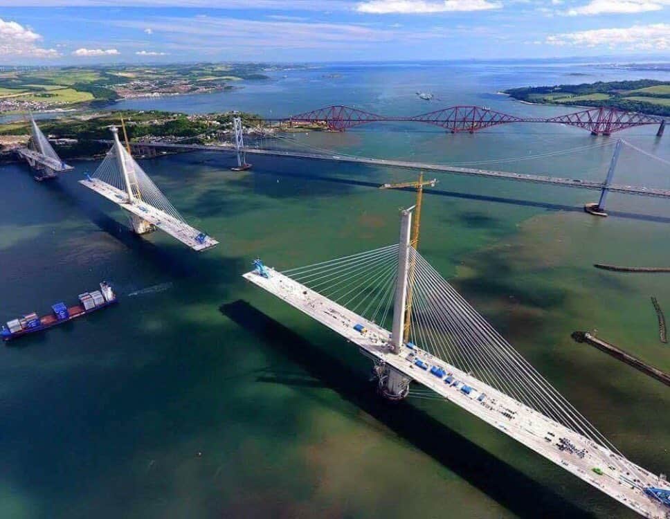 Past, present and future: the Victorian Forth Bridge (background); the 1960s Forth Road Bridge (centre) and Queensferry Crossing, under construction in the foreground
