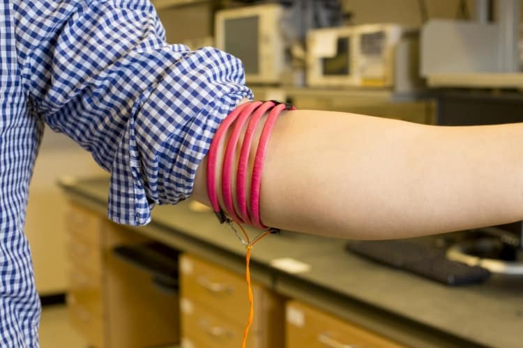 Prototype of the magnetic field human body communication, developed in Mercier's Energy-Efficient Microsystems Lab at UC San Diego, consists of magnetic-field-generating coils wrapped around three parts of the body, including the head, arm and leg.