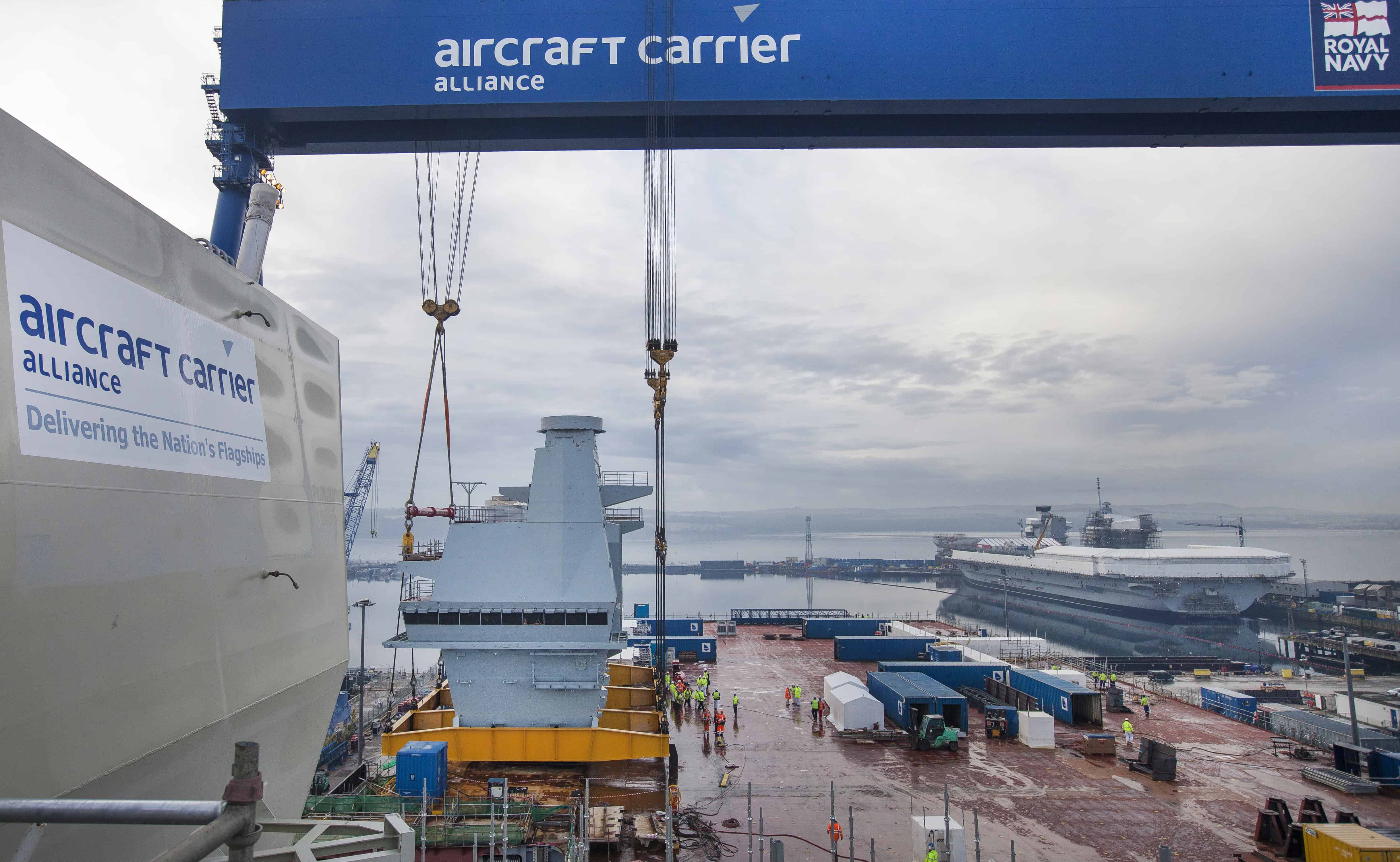 Prince of Wales Aircraft Carrier Construction Rosyth Naval Dockyard, Friday 8 January  The Aft Island, which will control aircraft operations aboard HMS PRINCE OF WALES, has been lifted on to the deck of the ship. Rosyth, UK: HMS QUEEN ELIZABETH and HMS PRINCE OF WALES will be the Royal Navy’s largest and most advanced ever warships and were constructed in blocks in different shipyards throughout the UK. The final section being delivered, known as the Aft Island, weighs 750 tonnes and will control aircraft operations aboard the second aircraft carrier, HMS PRINCE OF WALES. The Aft Island, which will control aircraft operations aboard HMS PRINCE OF WALES, has been lifted on to the deck of the ship. Photo Credit Drew Farrell / BAE Systems First Use Supplied Courtesy of BAE Systems For Further Details : Please contact Drew Farrell (photographer) T : 07721735041 Sofia Naz ACA Communications Associate T 01622 778533 | M 07525078502 | sofia.naz@baesystems.com www.baesystems.com