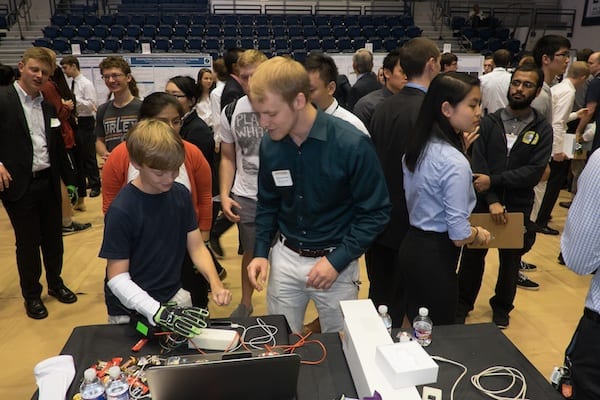 Engineering student Kevin Gravesmill demonstrates the Hands Omni glove created at Rice University for virtual reality gaming systems at the annual Engineering Design Showcase