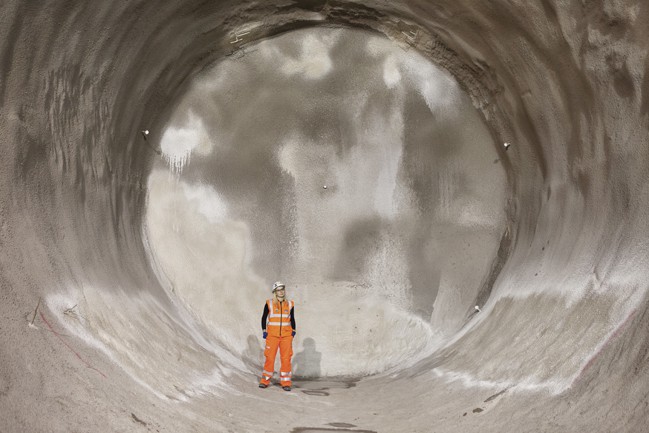Crossrail Section Engineer Olivia Perkins inspects the new Crossrail passenger tunnels being constructed under London's Oxford Street