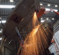 Heavy metal: Engineers at the Portsmouth shipyard working on the Trinidad and Tobago OPV Port of Spain, due to begin sea trials before the end of the year