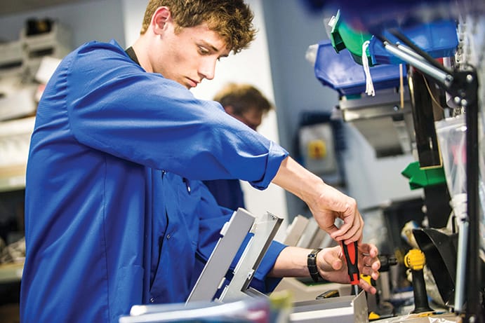 Production Engineer assembling a Neurotherm device 