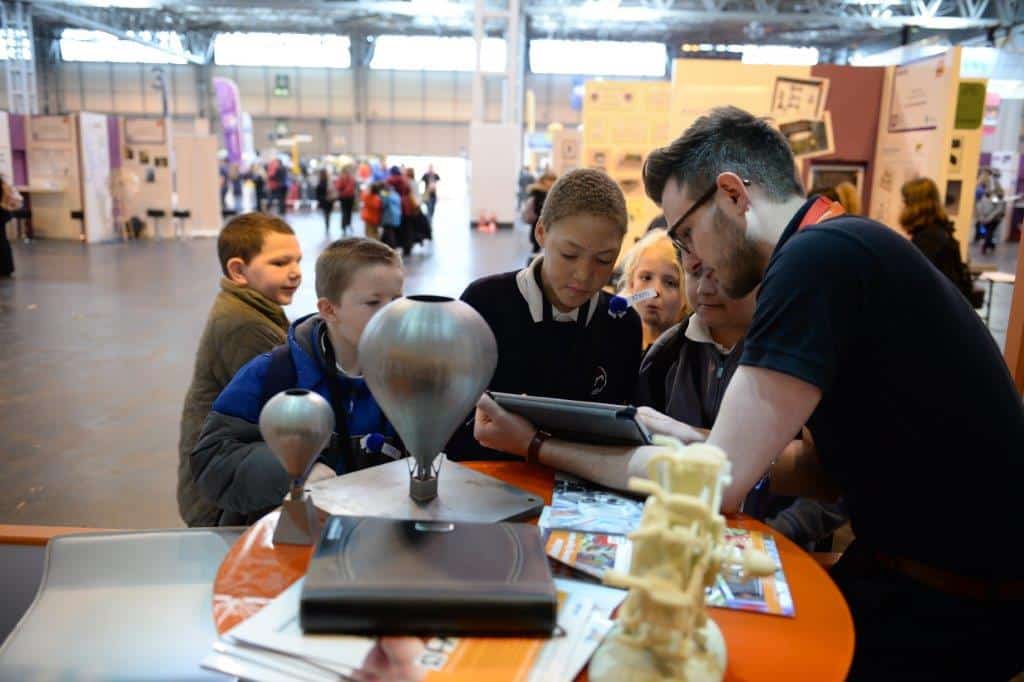 Renishaw employee with children at Big Bang Fair 2014