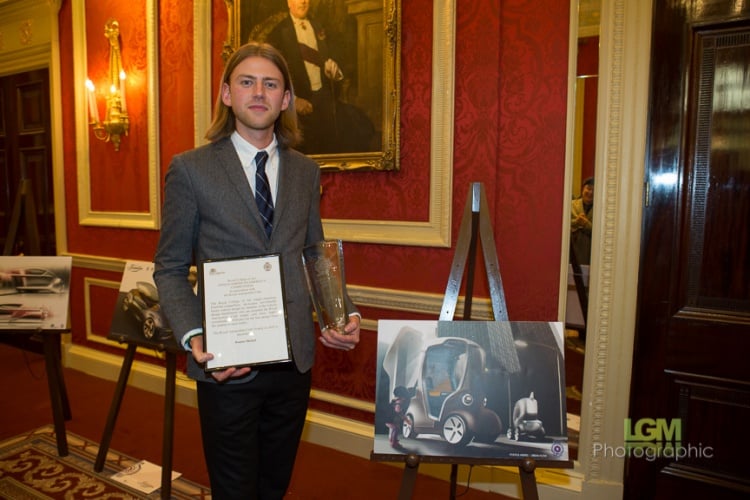 Pontus Merkel alongside a sketch for his winning entry.