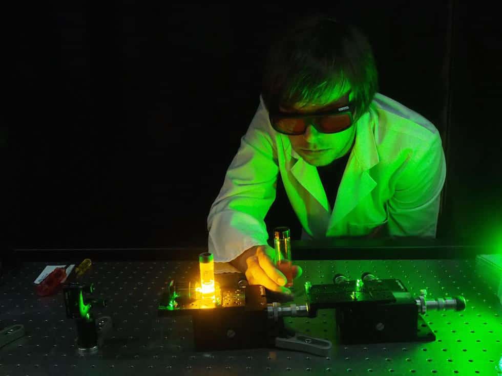 Dr. Erik Schartner demonstrates an experimental system of the optical fibre probe. (Credit: University of Adelaide)