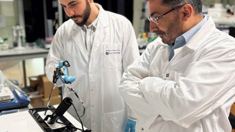 Wael Othman and Mohammad A. Qasaimeh with the off-the-jaw tactile feedback system
