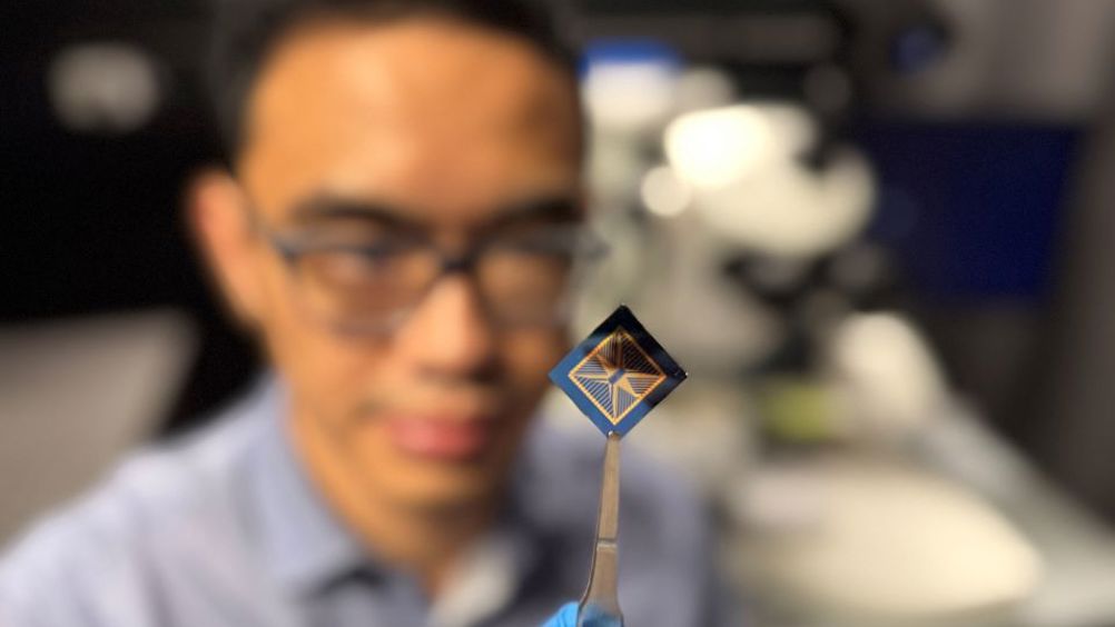 RMIT PhD student and study first author Thiha Aung inspects the team's neuromorphic vision device