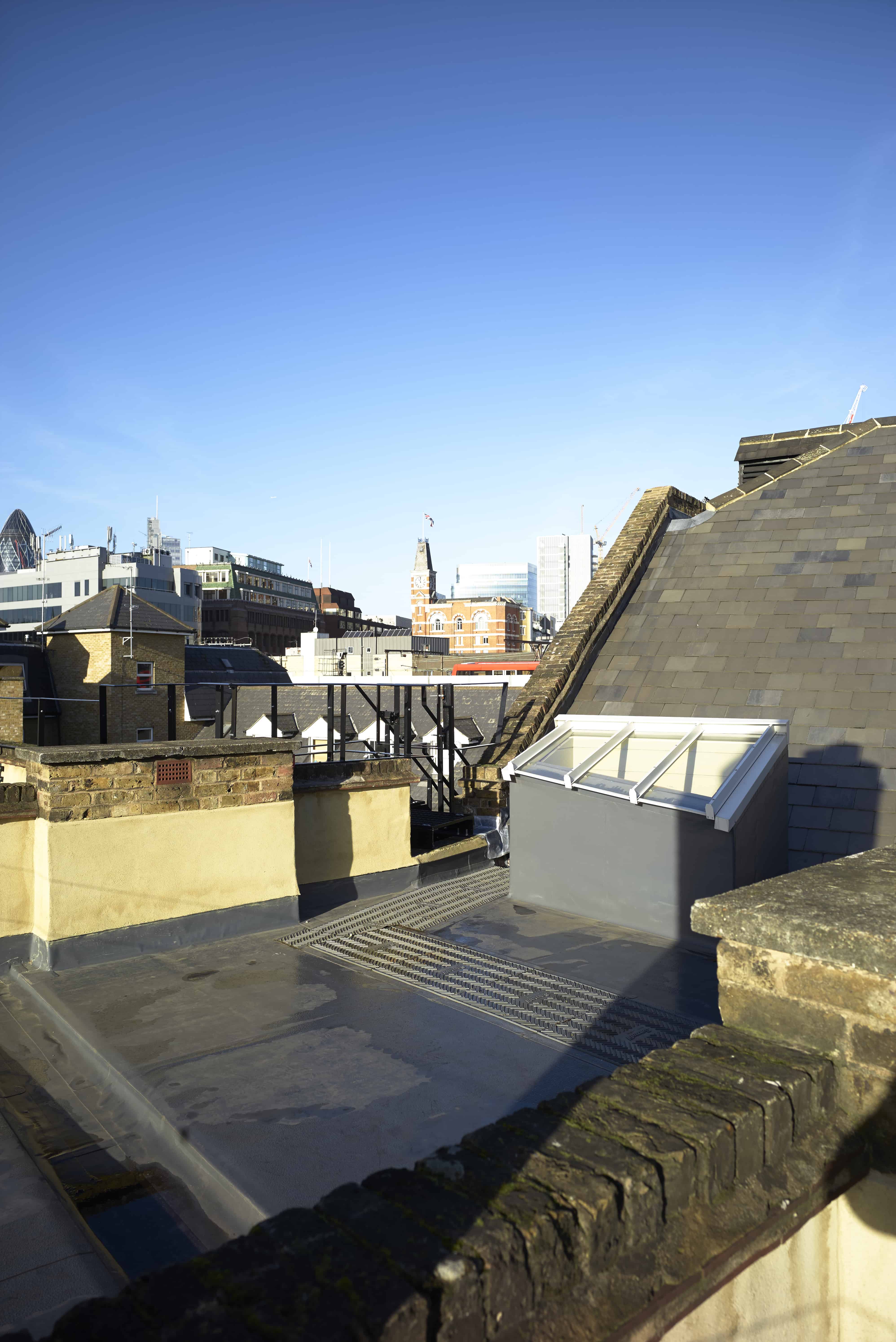 Air handling equipment to vent the building is placed unobtrusively on the roof.