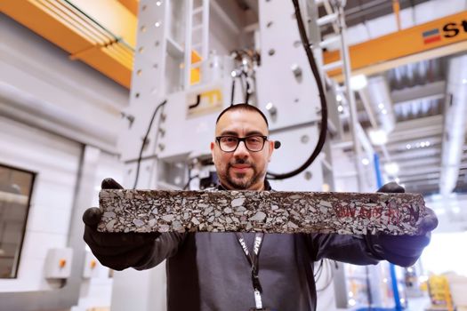 Dr Jose Norambuena-Contreras with a sample of self-healing road