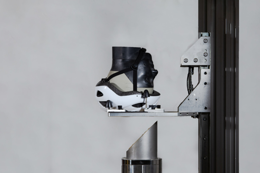 Impacts are simulated on a helmet test rig developed at Imperial College London