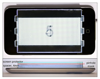 Researchers placed a printed pinhole array mask on top of an iPod touch as part of their prototype display. Shown above are top-down and side-view images of the setup