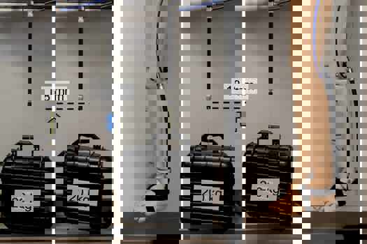 Left: Evaluation of the effect of the assistance on the activity of the biceps muscle while lifting a weight of 5kg. Results showed that on average the muscle activity was reduced by 39 per cent with assistance compared to the condition without wearing the device. Middle: Demonstration of high assistive force: the muscle can lift a 20kg object 18mm off the ground. Right: Proof-of-concept demonstration of wearable robot application to assist ankle plantar flexion