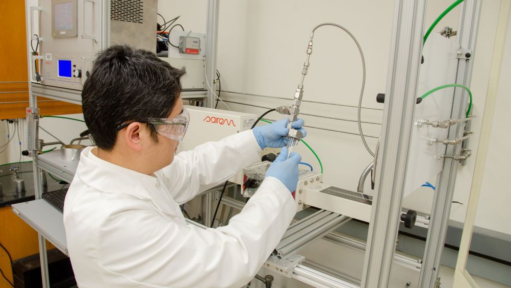 WVU researcher Yuxin Wang loads polypropylene into a microwave reactor