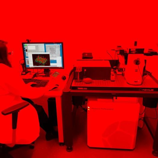 Researcher using nanoscribe – the printing has to be undertaken in orange light