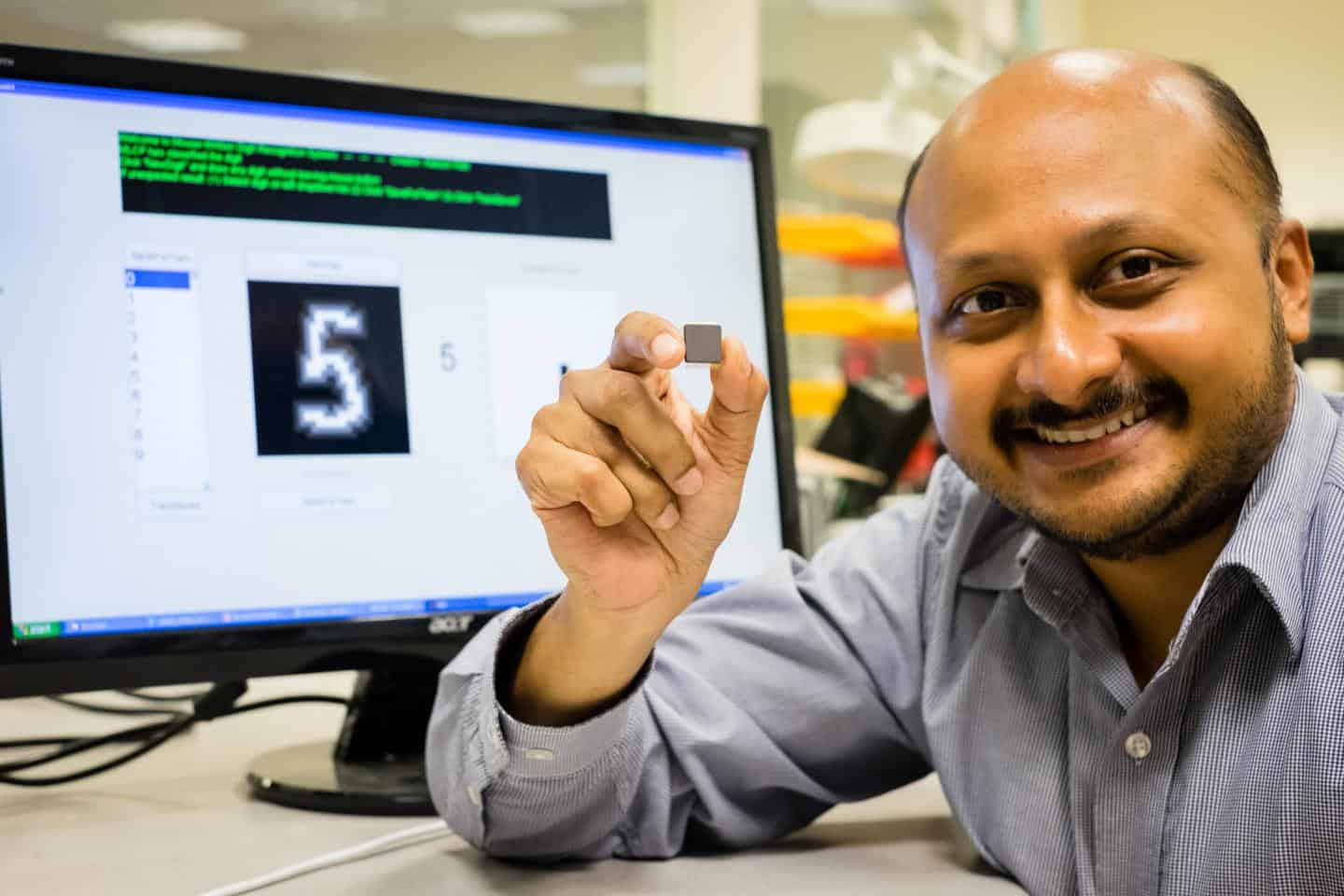 NTU Asst Prof Arindam Basu is holding his low-powered smart chip.NTU Asst Prof Arindam Basu is holding his low-powered smart chip. Image courtesy of NTU Singapore