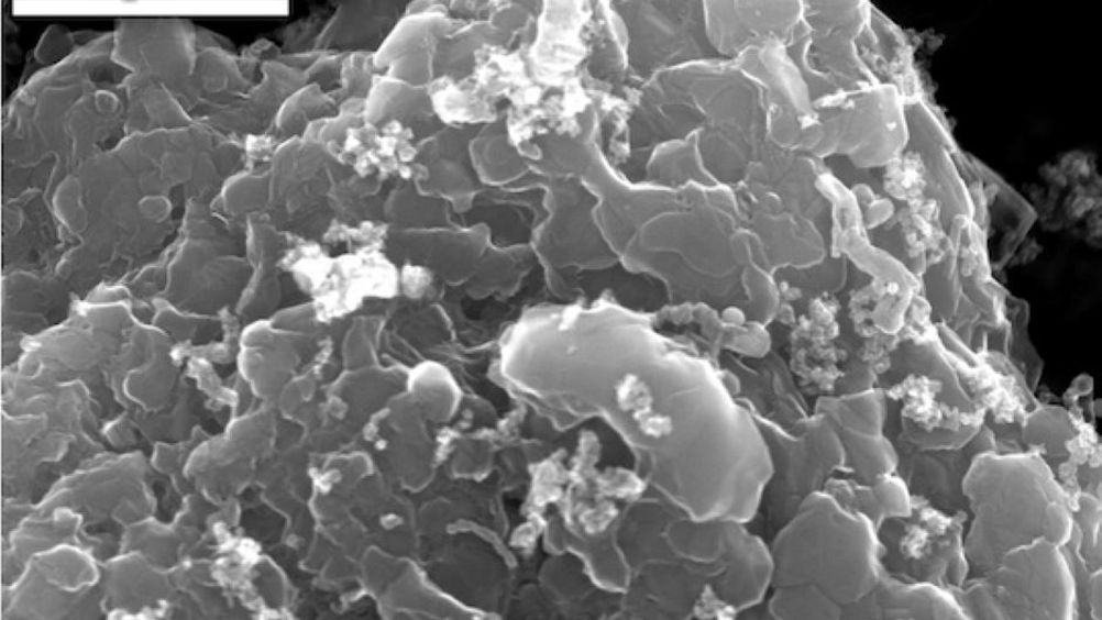 Scanning electron microscope (SEM) image of layered stacks of nano-scale flash graphene sheets formed from waste plastic