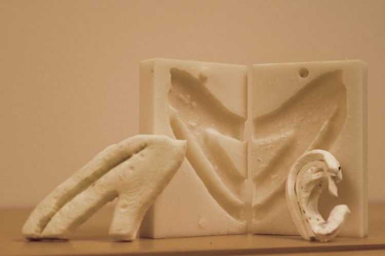 The UW team used a 3D printer to create a negative mould of a patient's ribs from a CT scan. Surgeons take pieces of those ribs and "carve" them into a new ear.